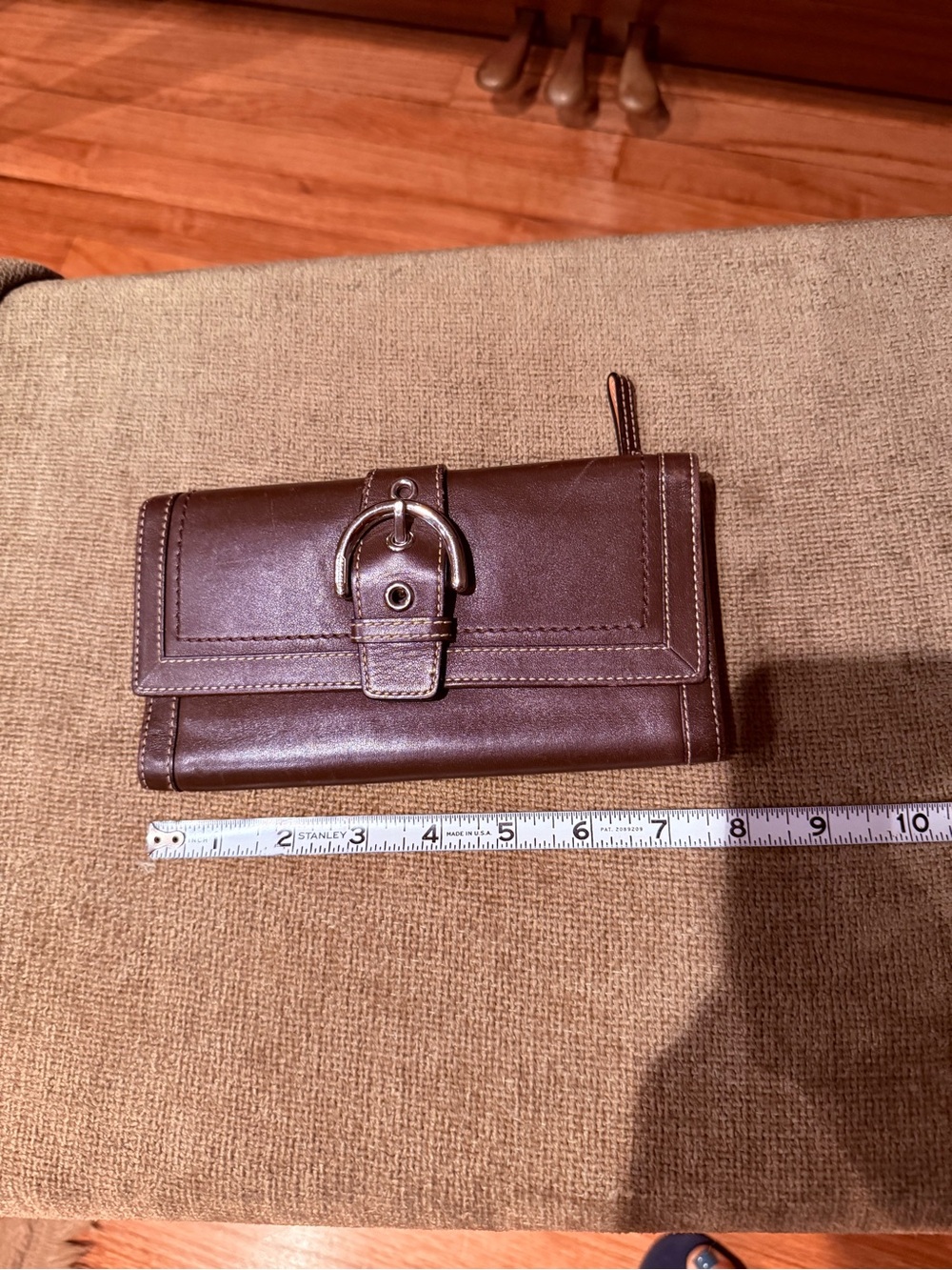 Coach Brown Leather Trifold Wallet with Silver Buckle Accent